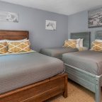 Renovated lodge room with queen and two twins at our hotel in Waitsfield, VT