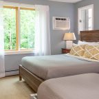 Renovated lodge room with queen and two twins at our hotel in Waitsfield, VT