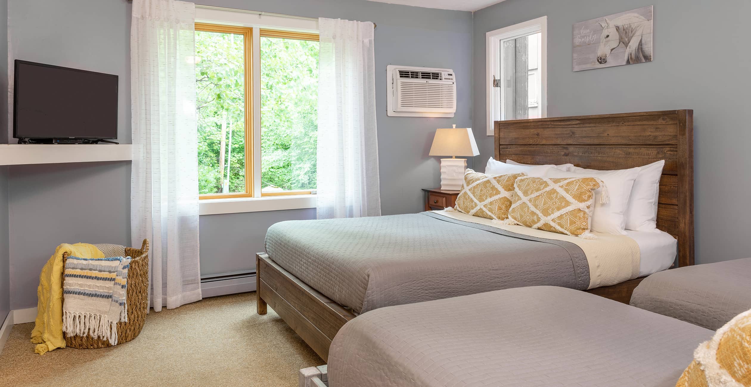 Renovated lodge room with queen and two twins at our hotel in Waitsfield, VT
