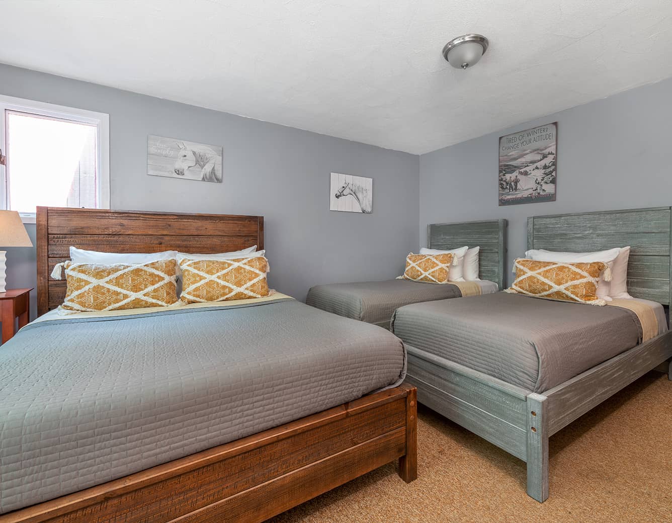 Vermont lodge room with queen bed and two twins