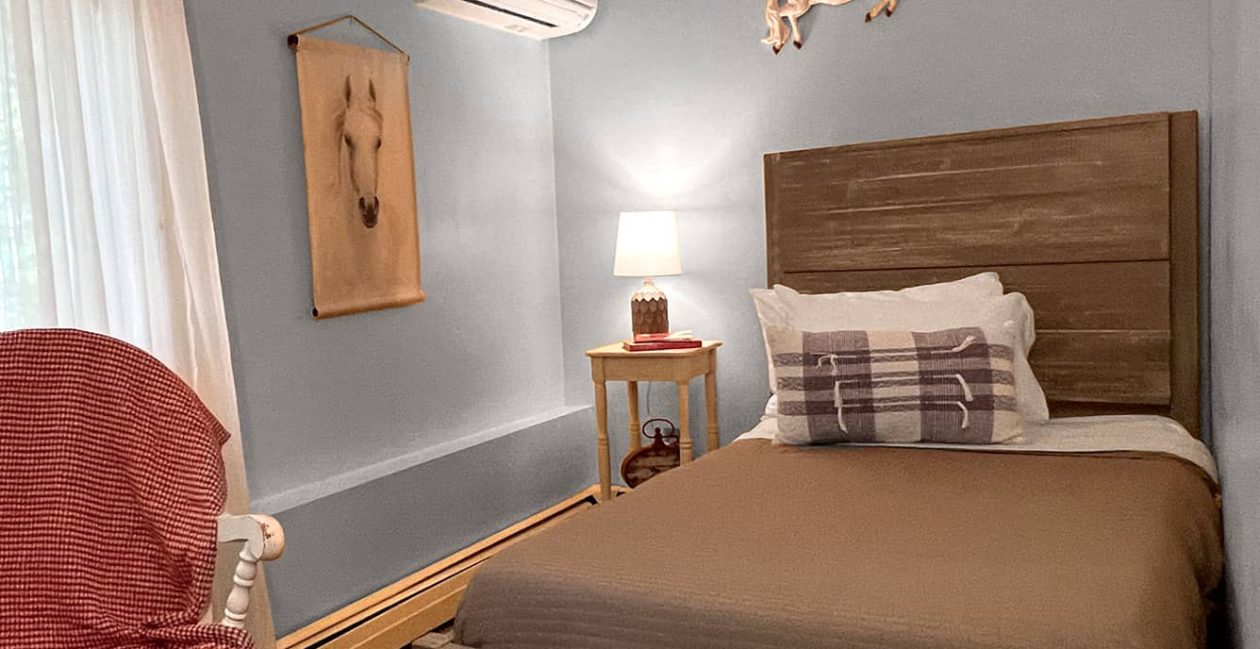 Twin Bed, white chair with red blanket
