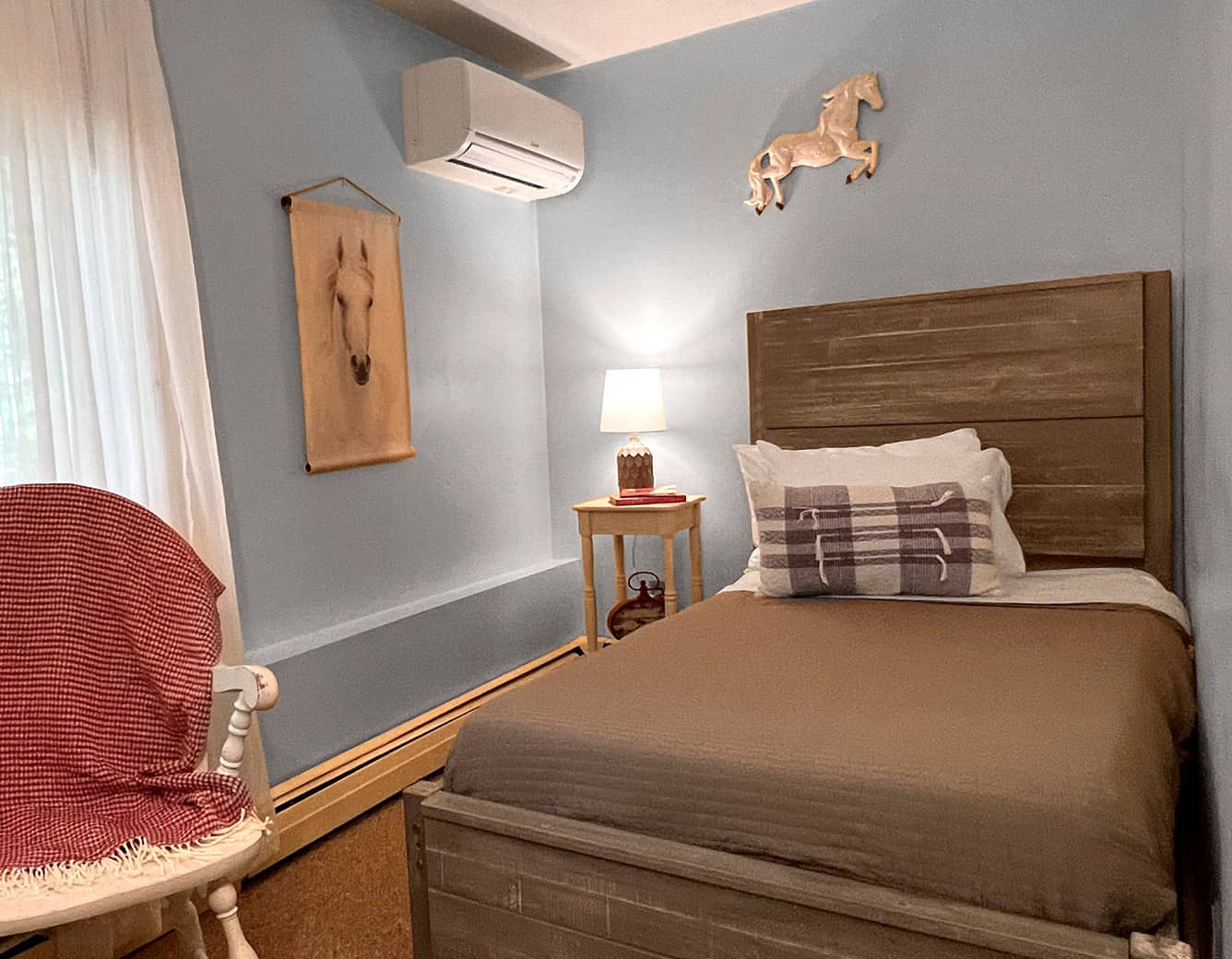 Twin Bed, white chair with red blanket