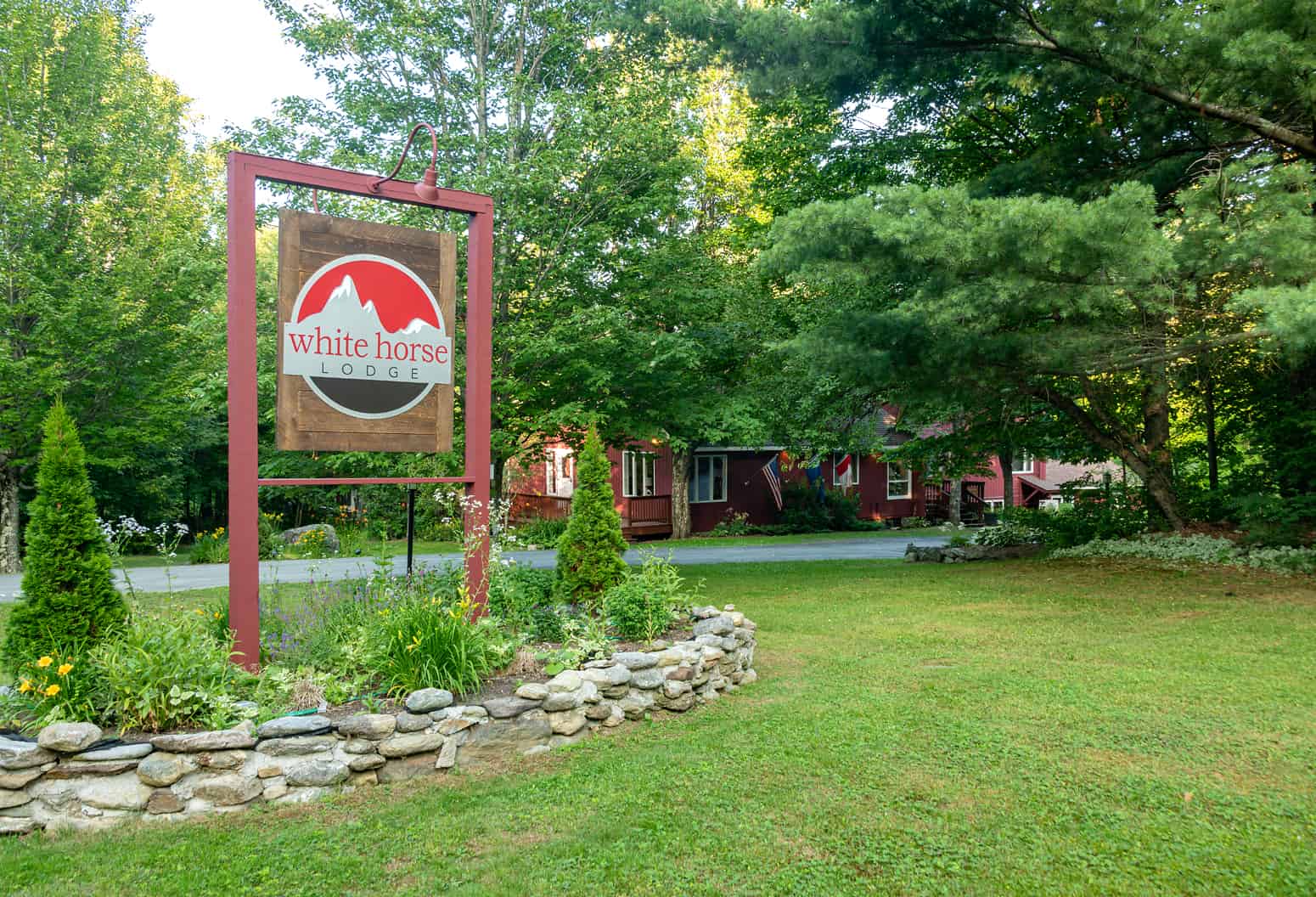 sign and exterior of White Horse Lodge in Vermont